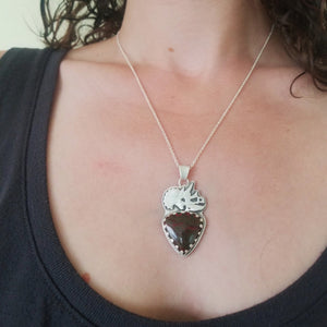 a woman wearing silver triceratops skull dinosaur bone necklace