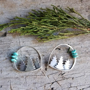 silver forest hoop earrings with turquoise beads with a juniper sprig